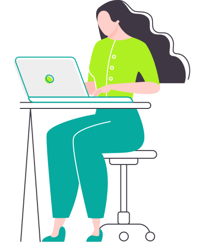 A woman seated at a desk, focused on her laptop, with a notepad and pen beside her.